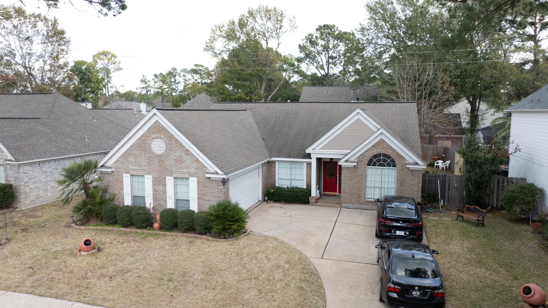 Close drone view of new shingle ridge lines on a Houston roof replacement
