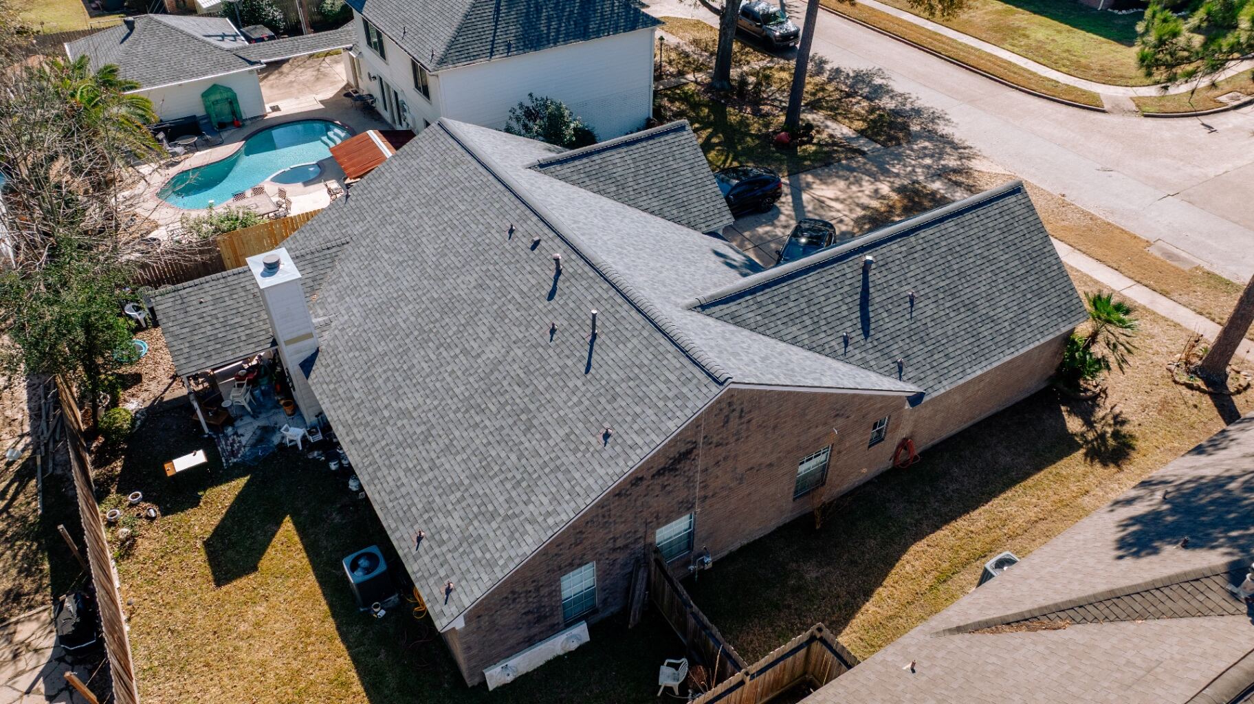 Aerial view of the same Valley Palms home after full roof replacement with fresh architectural shingles