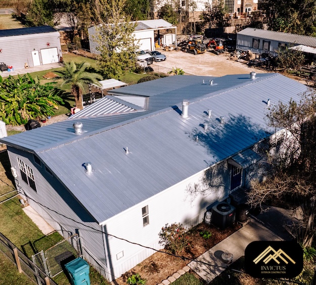 Aerial view of a completed silver metal roof on a Houston area home by Invictus Exterior